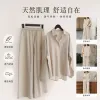 A beige shirt paired with beige wide-leg pants set for women's casual commuting looks slimming and drooping full image